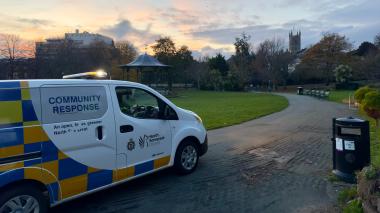 Community response van parked on Grove Park at sunset